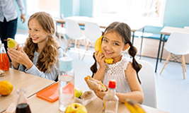 students having meal in class
