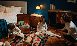 kids and childcare provider playing