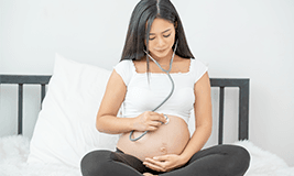 pregnant mom listening baby