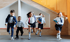 children in uniform running