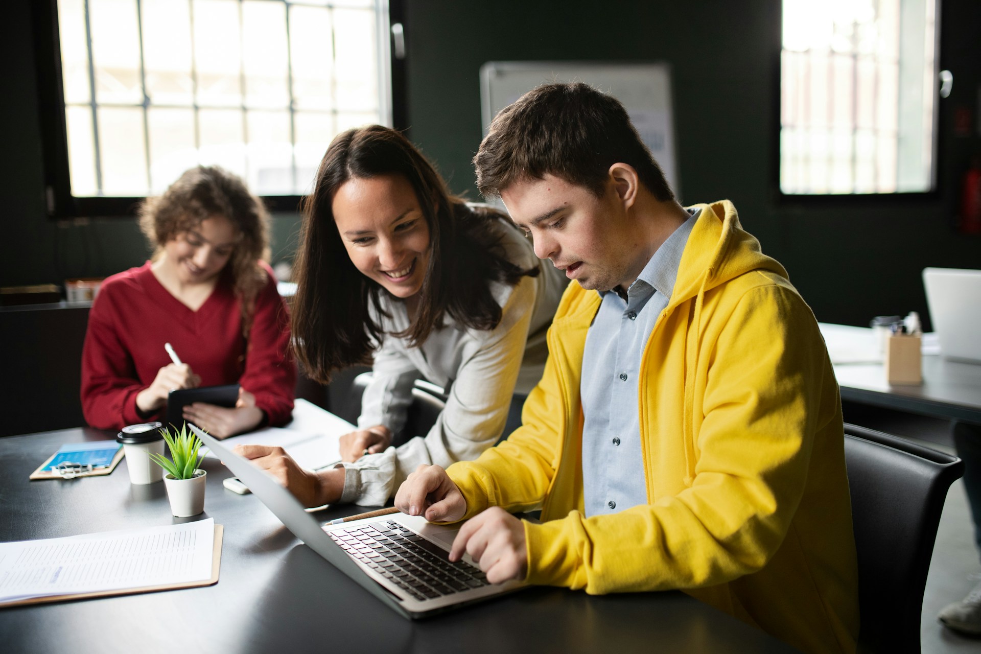 Young man in office using laptop