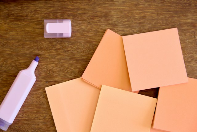 pen with post it notes on desk